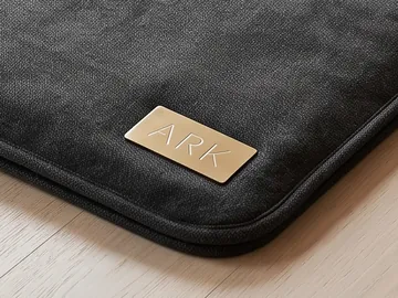 Detail: the gold ARK badge
