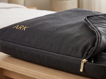 Detail: the zip opening and the ARK mark